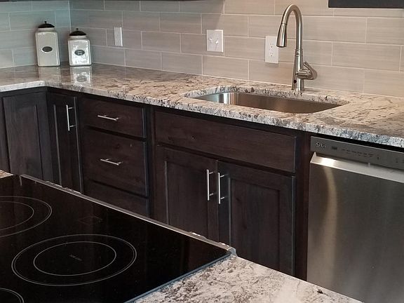 Custom kitchen with granite and new appliances