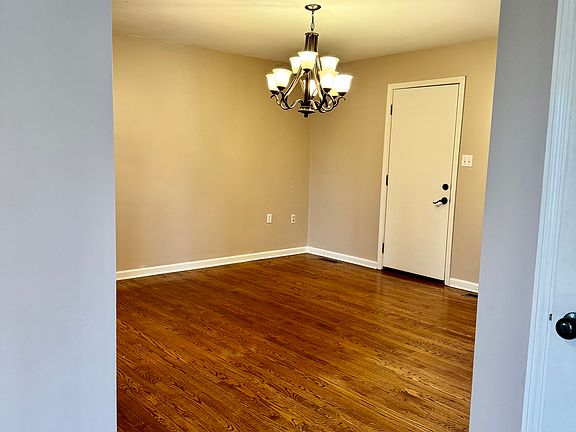 Living room or dining room with door to the garage.