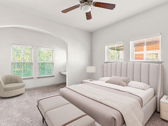 Retreat to a bedroom built for relaxation.