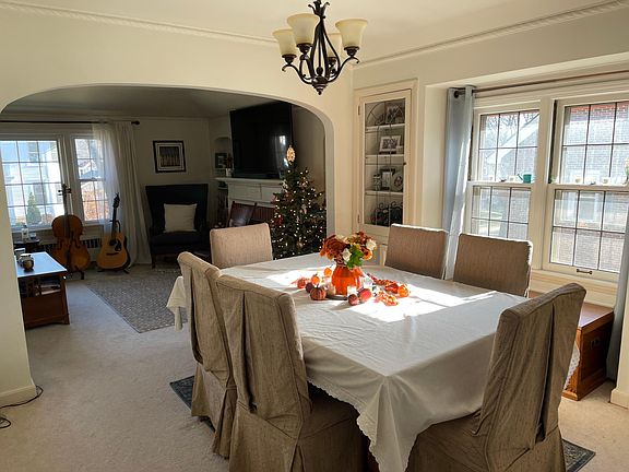 A portion of the dining room as seen from the vestibule. More windows to keep the space bright. Matching corner cabinets on each side of the windows.