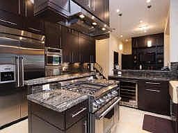 This fabulous gourmet kitchen has stunning granite, cabinetry and top-of-the-l