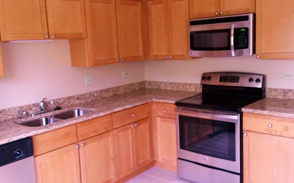 Huge kitchen with granite tops and stainless steel appliance