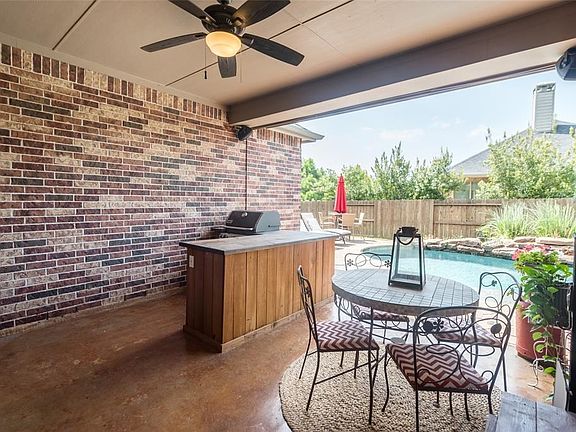 Lovely Covered Patio with ceiling fan and outdoor speakers