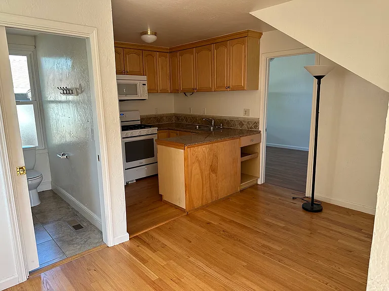 First floor showing dining area, kitchen, and bathroom.