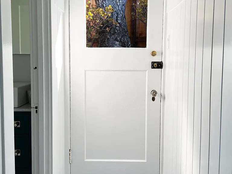 Back door of home. Close to the Laundry Room,'Garden Bedroom' and Back Bath.