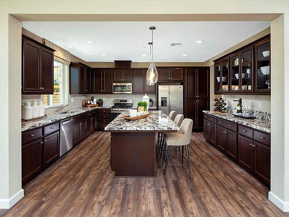 This stylish plan showcases a gourmet kitchen with eating bar and ample counter space for food prep,