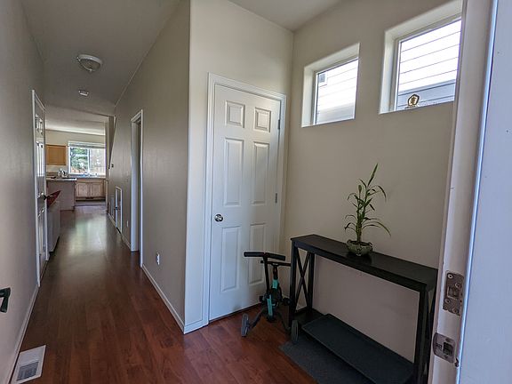 1st Floor - Main entry corridor showing the coat closet, garage door on the left