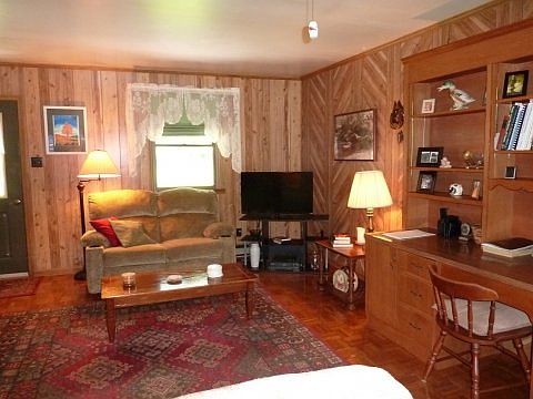 Pristine paneling & parquet.