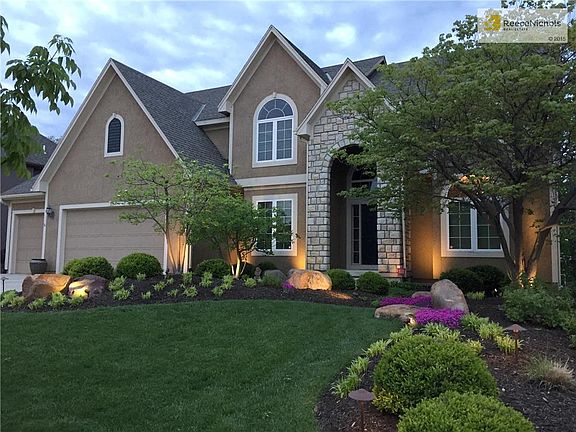 Gorgeous professional landscaping and lighting.