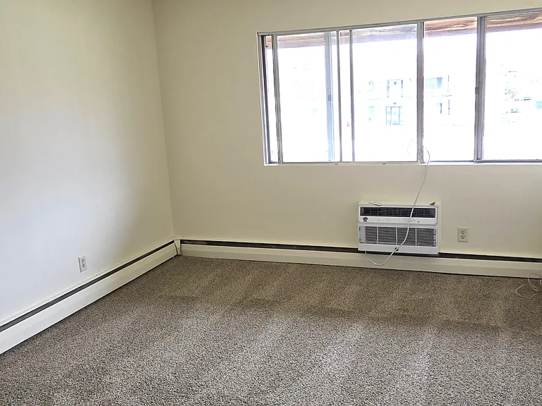 Bright living room with new carpet.