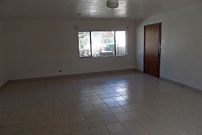 Front door opens to great room with tile floor