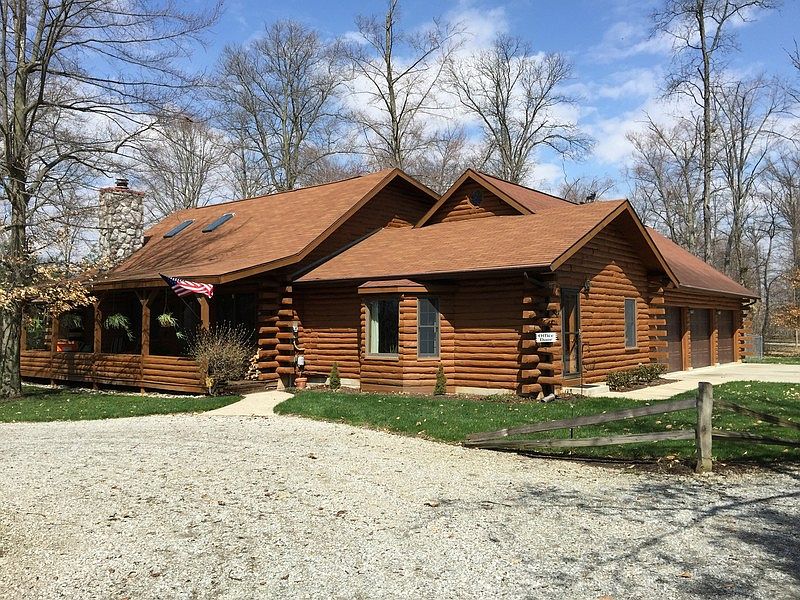 front/side view showing 3 car garage