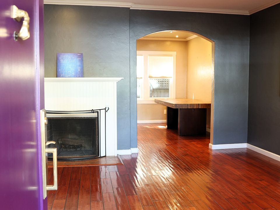 Living room with fireplace and hardwood floors