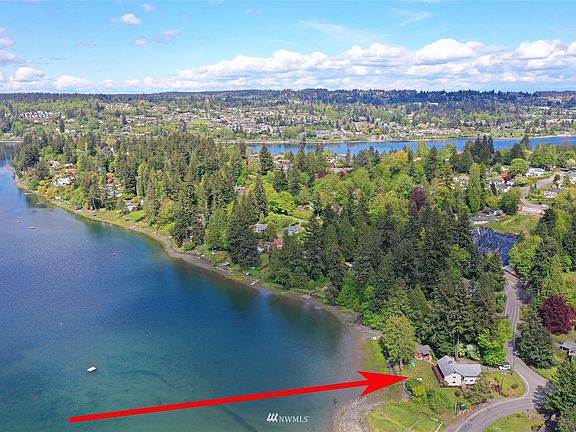 Come on...own the head of Phinney Bay offering 190 ft of your own waterfront with boat slip!