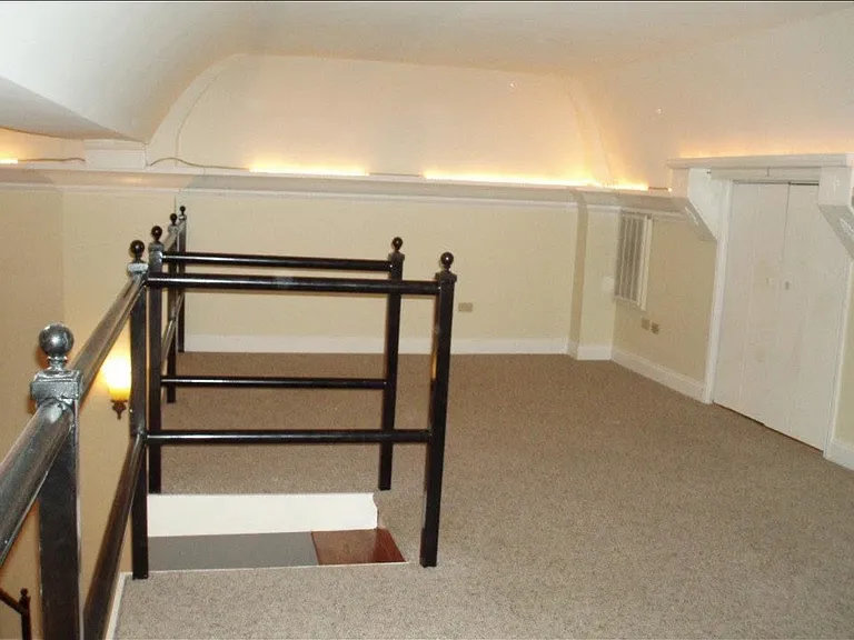 Loft space! Tall enough for comfortable standing, perfect for home office, additional lounge or gaming /movie area. Small storage space located in the loft as well!