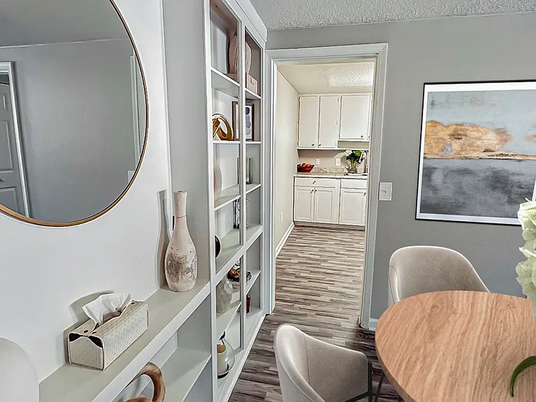 Conveniently located off the kitchen, this inviting dining space is filled with natural light and perfect for daily dining.