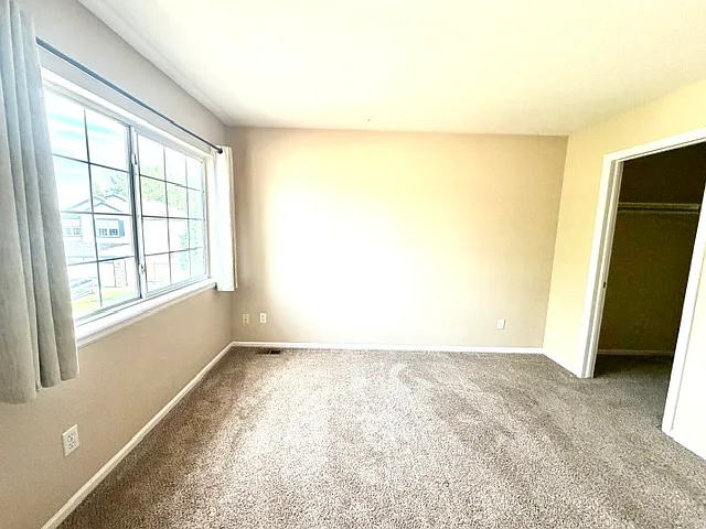 Guest bedroom #2 with a walk-in closet.