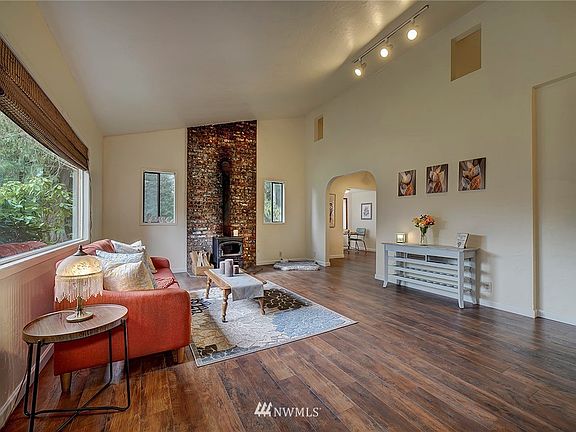 Come in and see this large living space with a cozy wood stove.