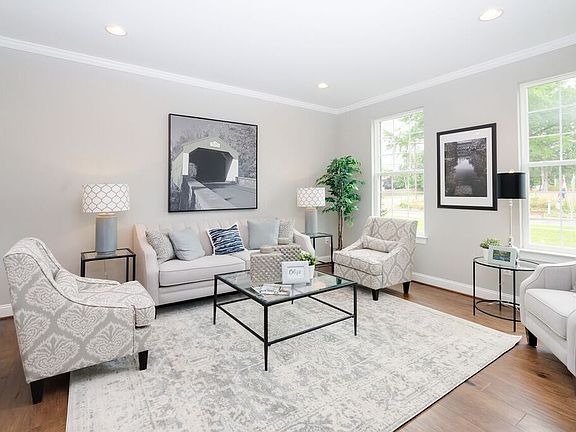 Living room with white furniture 410 Oxford Drive from Hallmark homes