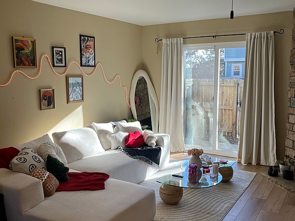 This is how my previous tenant furnished the living room. Southern exposure windows provide ample light.