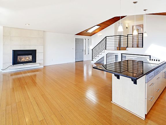 Open concept living room and island kitchen.