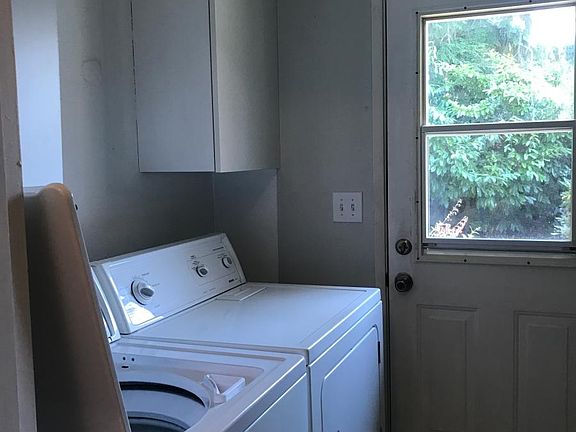 Utility room with full size washer and dryer