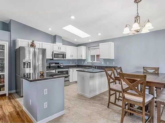 Come home to this bright and spacious kitchen where you can easily prepare meals and entertain your friends and family in this open floor plan.