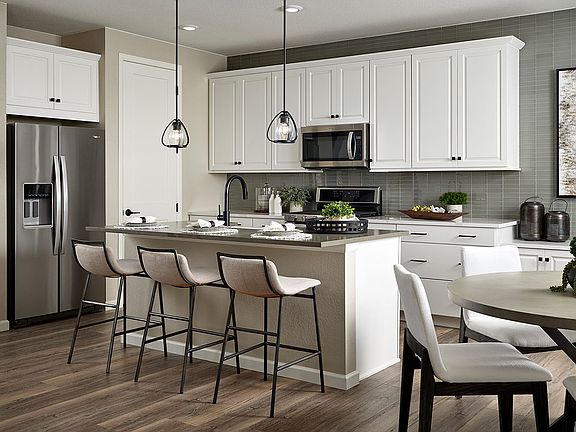 Kitchen with White Cabinetry and Stainless Steel Appliances