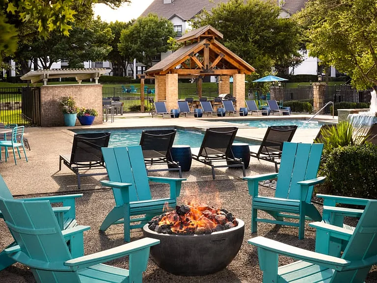 Outdoor resident lounge with serene firepit and seating