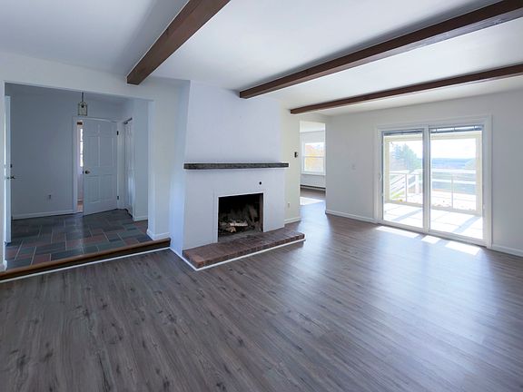 Living Room with sliding glass doors that open to porch and deck.