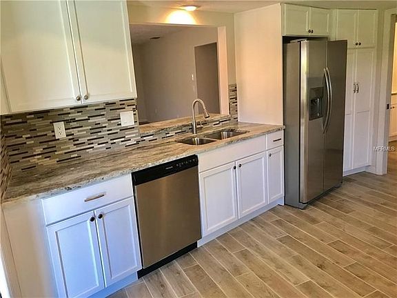 All new custom made cabinetry, new tile backsplash, new sink, new faucet all new stainless steel appliances