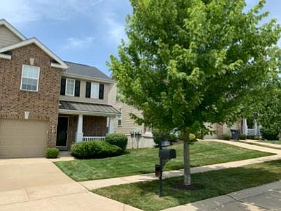 Single car driveway and front exterior view.
