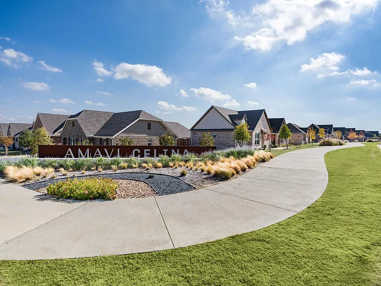 Landscaped pathways and a welcoming community entry set the tone for connected living among thoughtfully designed single-family homes in Celina.