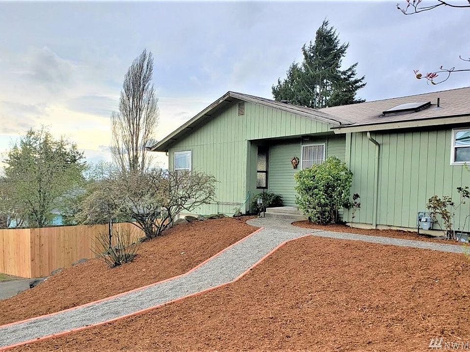 All new bark with an edged gravel pathway make this home lovely and inviting.