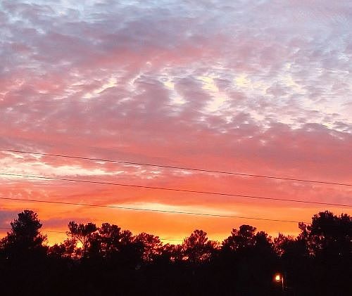 Sunrise 8039 Eastern Circle east facing hill top home view. Sip your coffee to this LIGHT show._