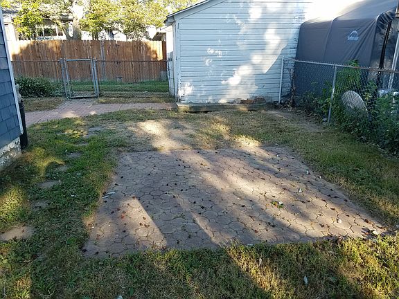 Patio & Storage Shed in Back Yard