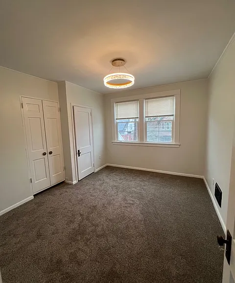 Spacious bedroom including 2 closets, updated paint and brand new lighting.