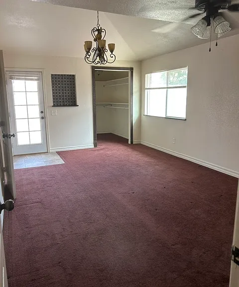 master bedroom, large walk in closet , door to back yard