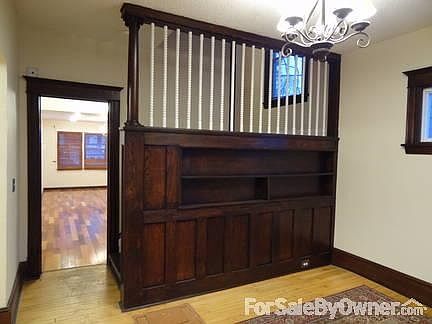 Entry Room 1
						:
						Beautiful oak bookshelf, trimwork, and chandelier give guests a warm welcome.
