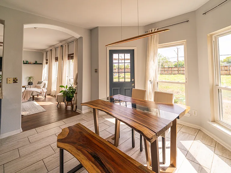Modern Dining & Entertaining: A dedicated dining space positioned right off the kitchen island. Large windows and easy backyard access make this a delightful spot for family meals.