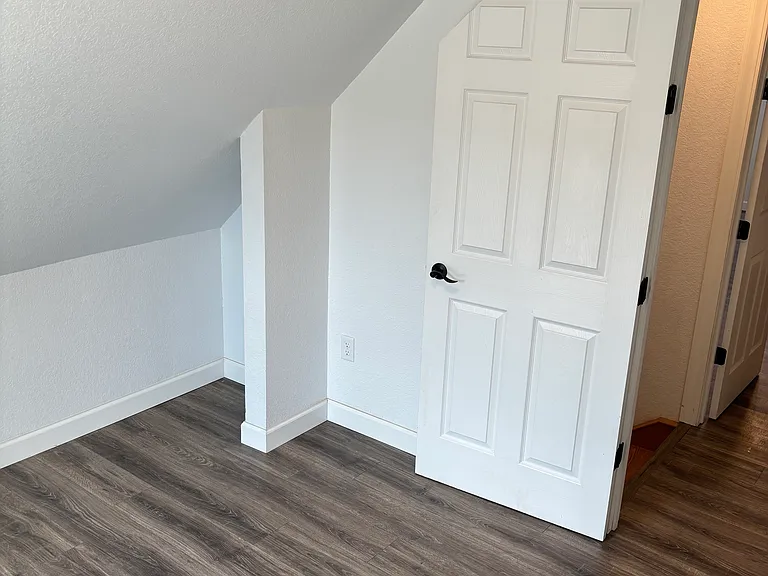 Second floor bedroom facing door way