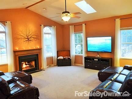 Family Room
						:
						20x20 room, cathedral ceiling, skylights, wood burning fireplace, arched windows
