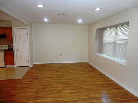 Open and bright living area feature large boxed window