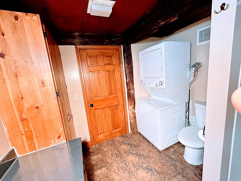 bathroom and laundry area. Note: Stackable washer and dryer are full size.