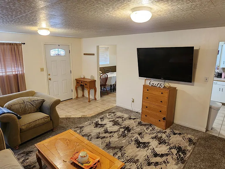 Upstairs Livingroom with newer large, high definition 65 inch TV.
