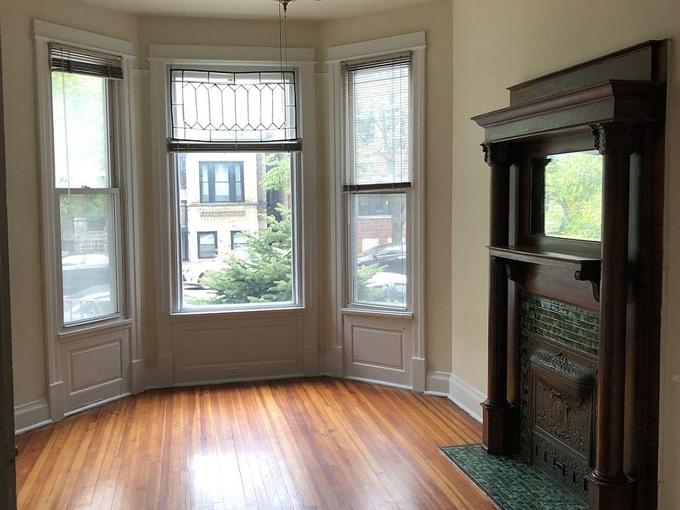 Living room, ceiling fan, ornamental fireplace, hardwood floors