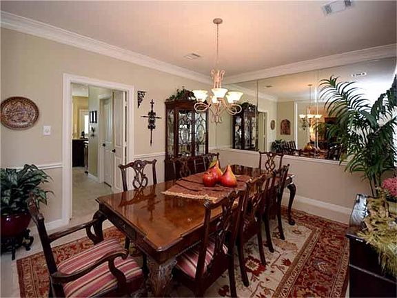 Large formal dining room for family or guests.