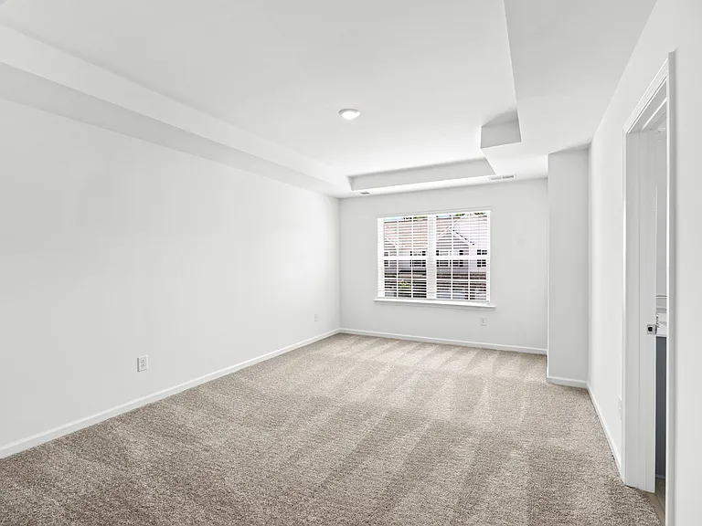 Bright Master Bedroom With Trey Ceiling