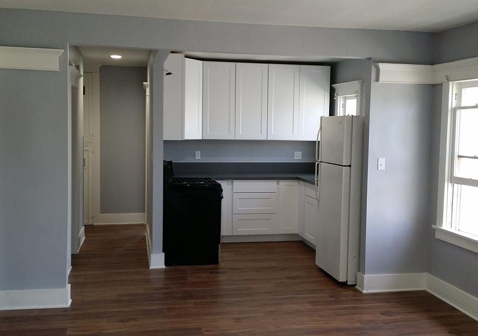 Looking into living room and kitchen. Entrance to the left o