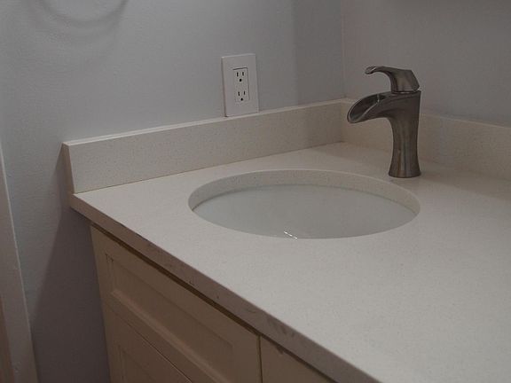 Main bathroom upper level - vanity w quartz counter and new